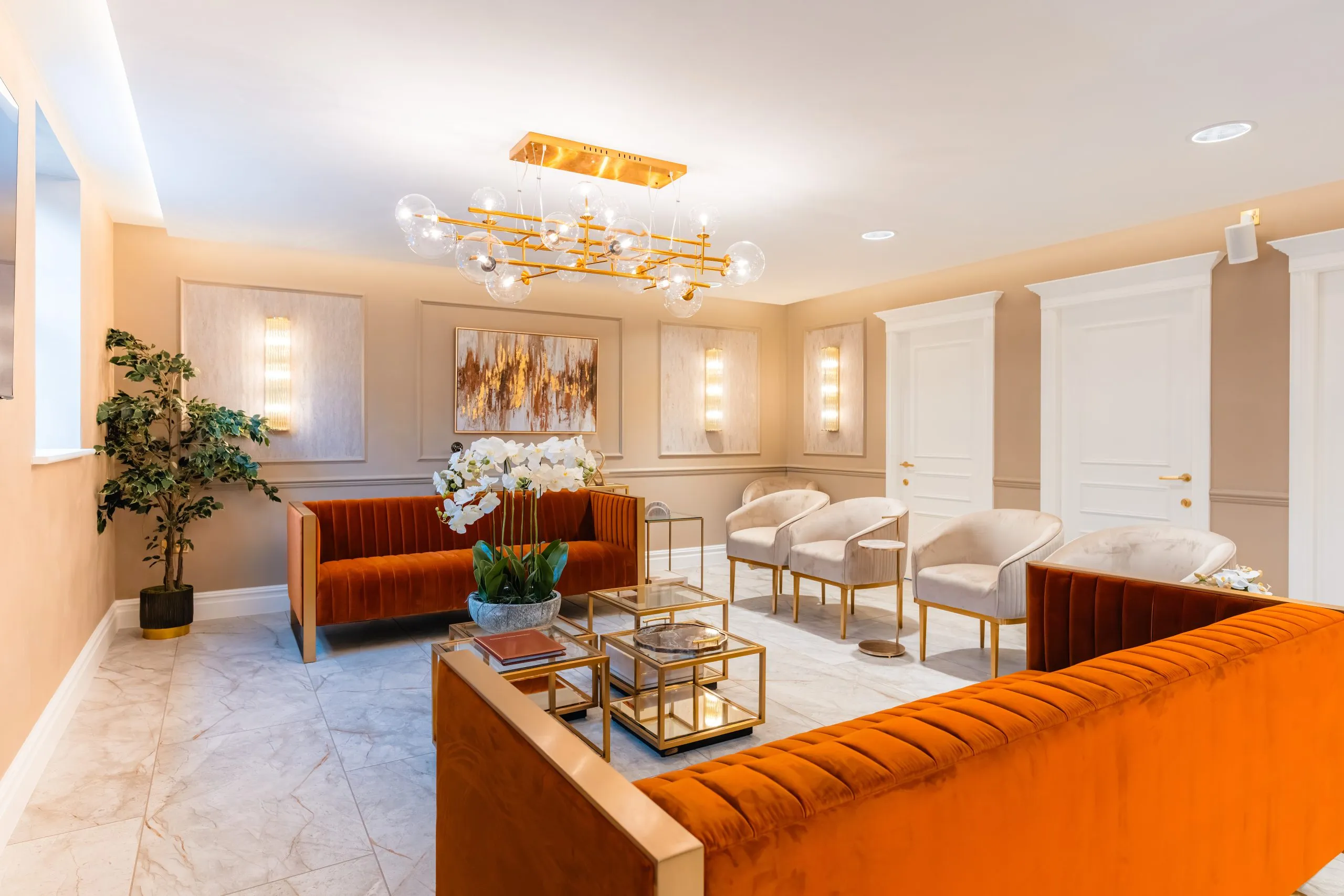 Burnt-orange velvet sofas in the waiting lounge at Bromsgrove Dental Specialists