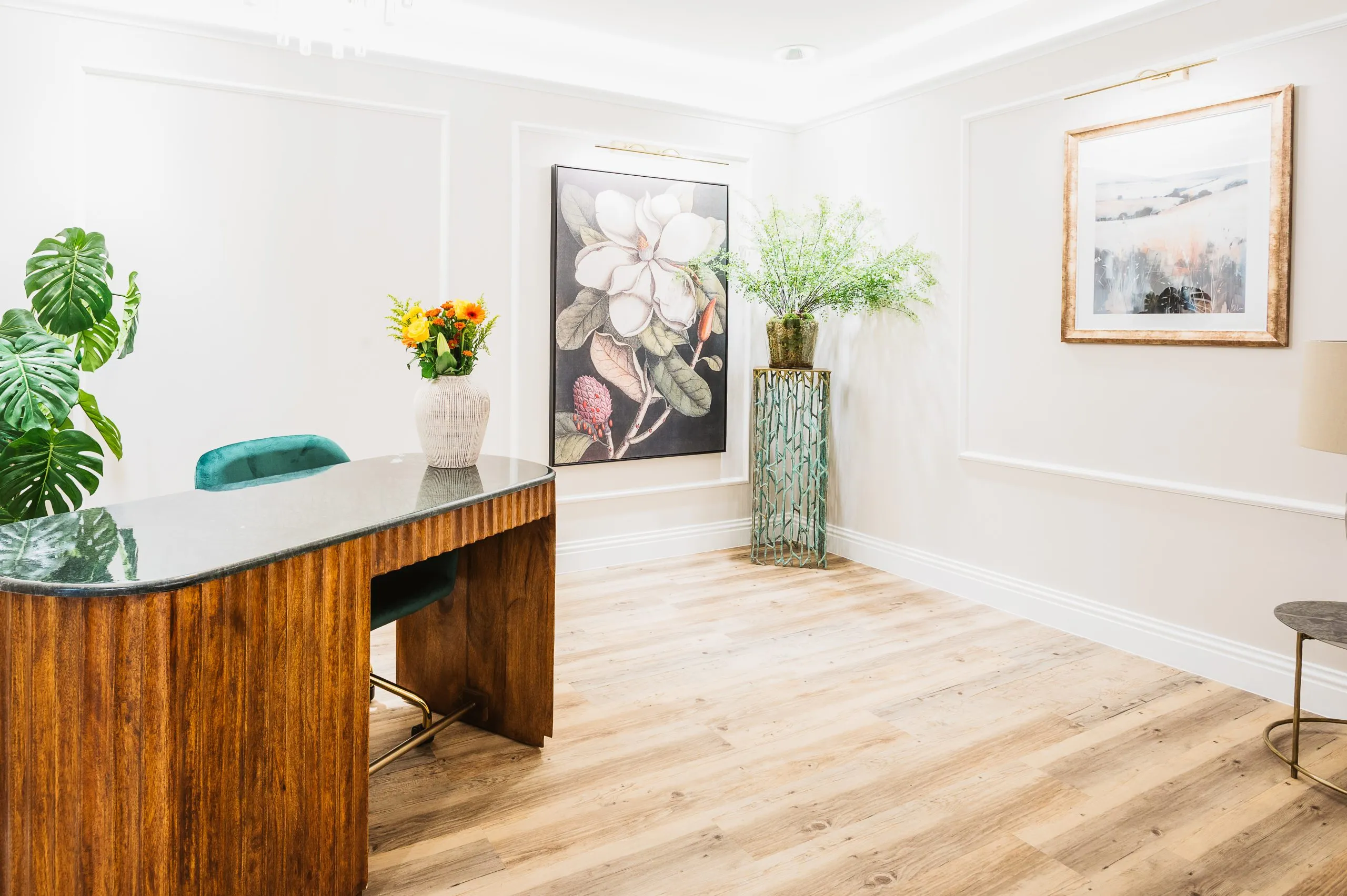 Walnut consultation desk at Bright Orthodontics, Liverpool — a dental practice designed by BH Projects Group